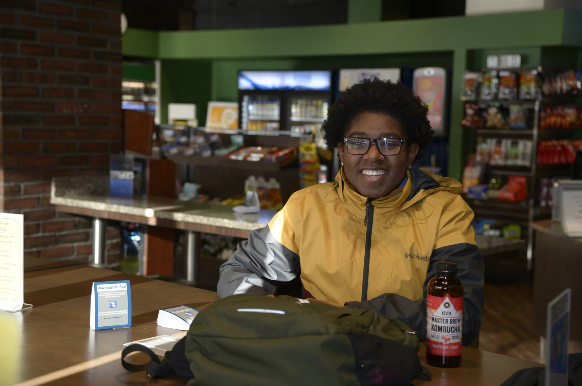 person smiling looking at camera at counter