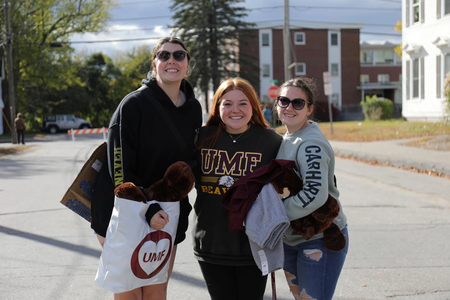 Three students smiling