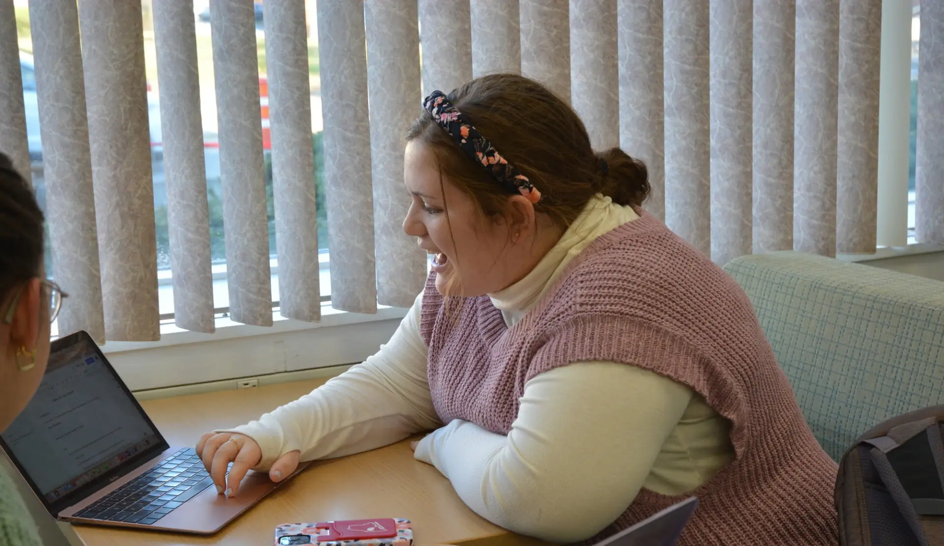 Farmington students works at laptop.