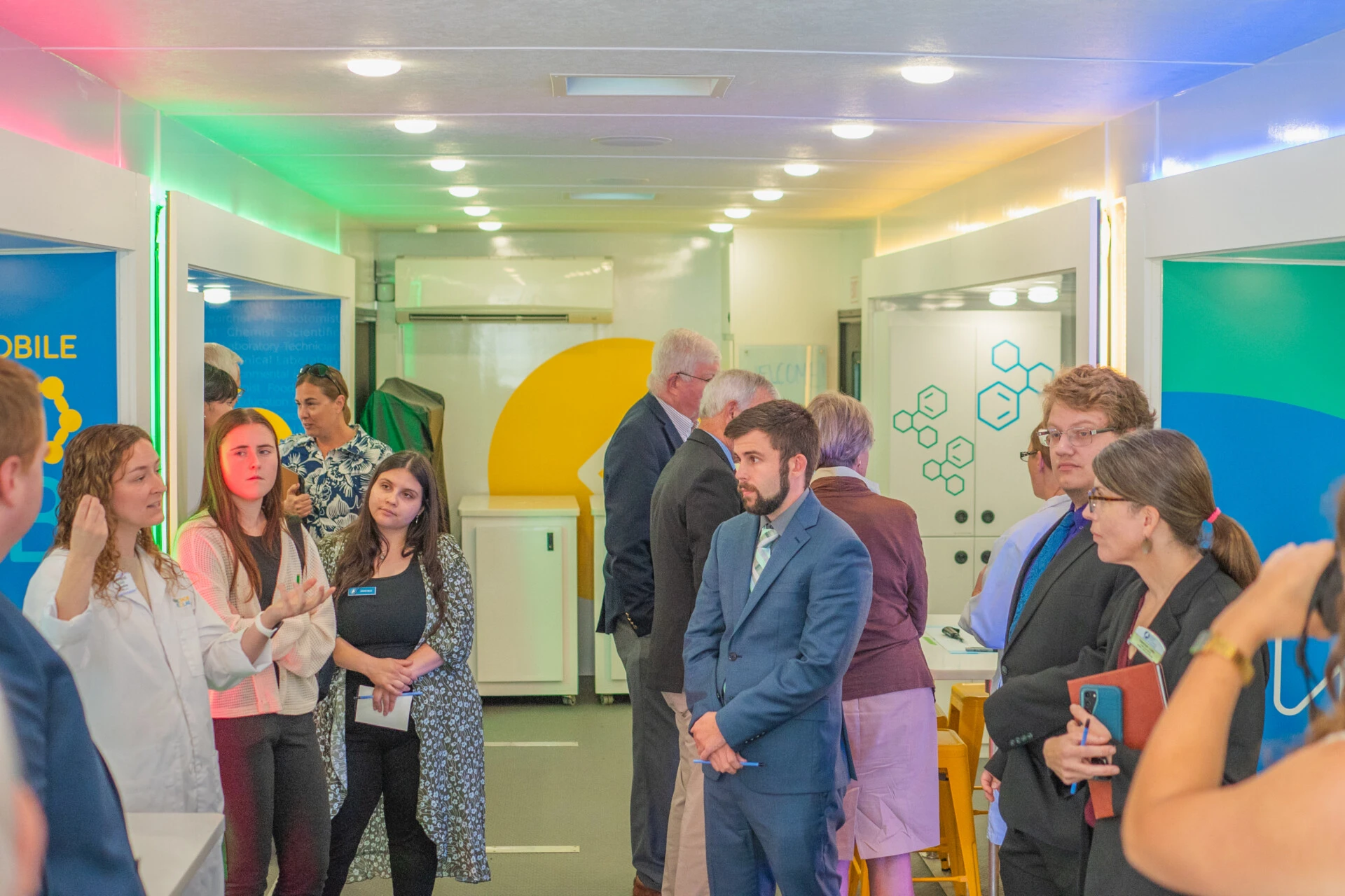 Graduate students and other adults at an event for Biology in the Bio Lab