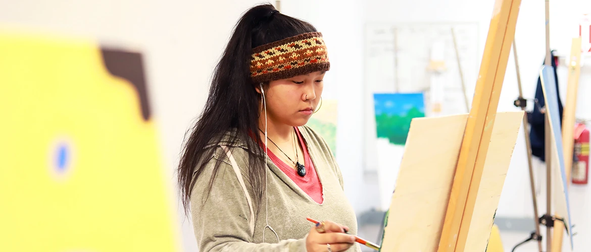 UMF art student paints.