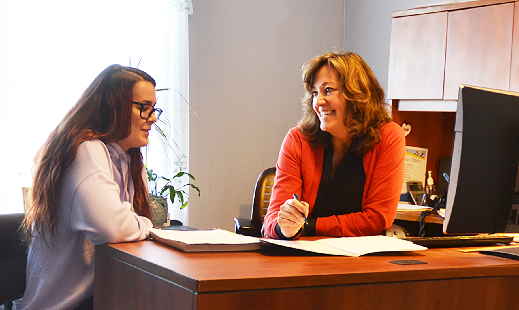 UMF advisor working with student