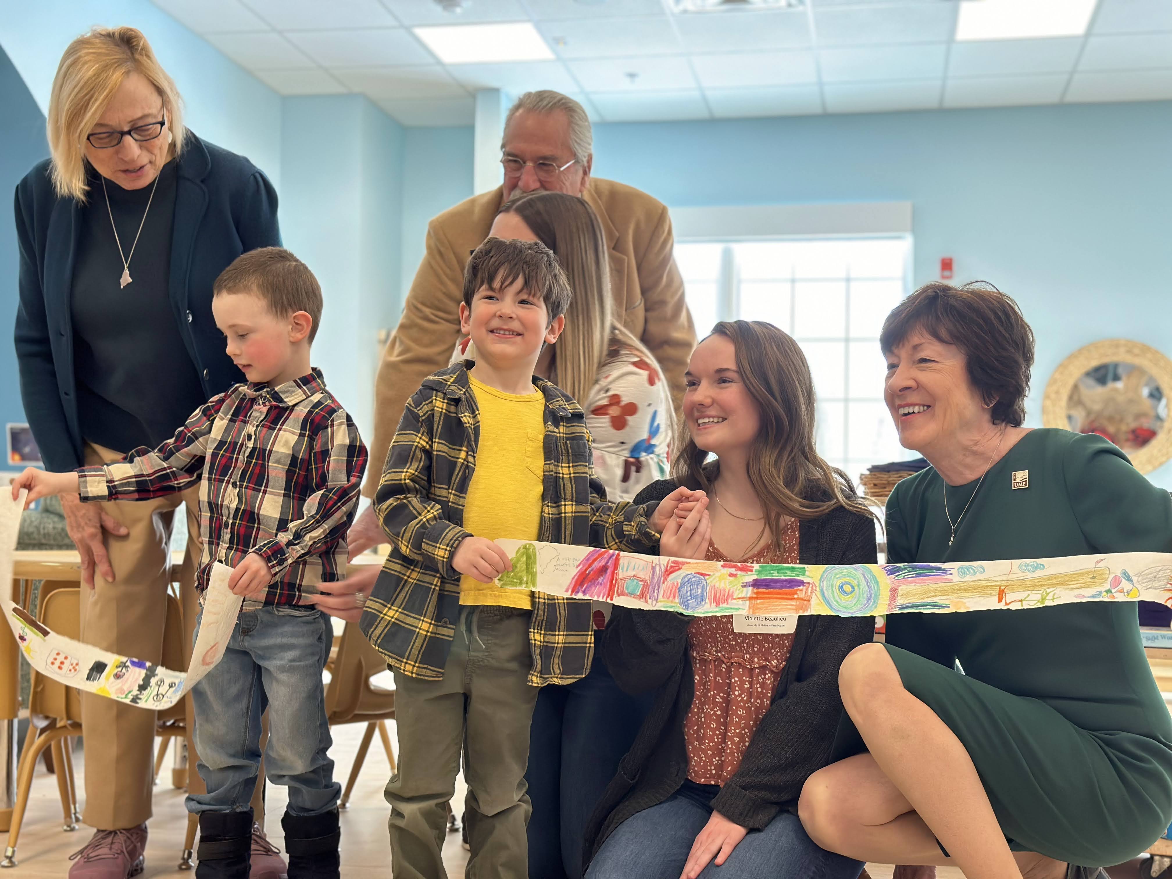 Maine Governor Mills and Senator Collins help Sweatt-Winter children with ribbon cutting.