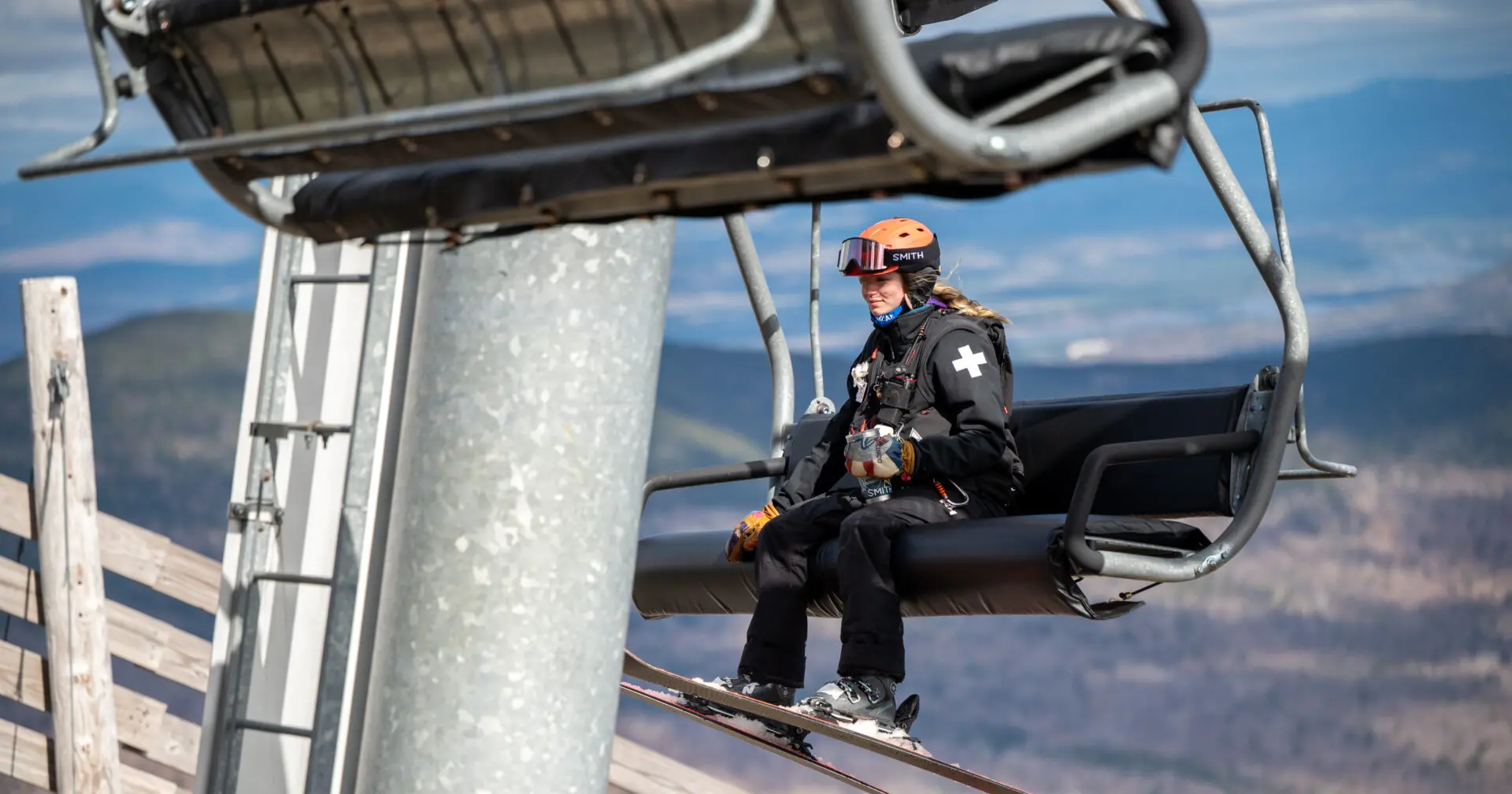 Leah riding a ski lift