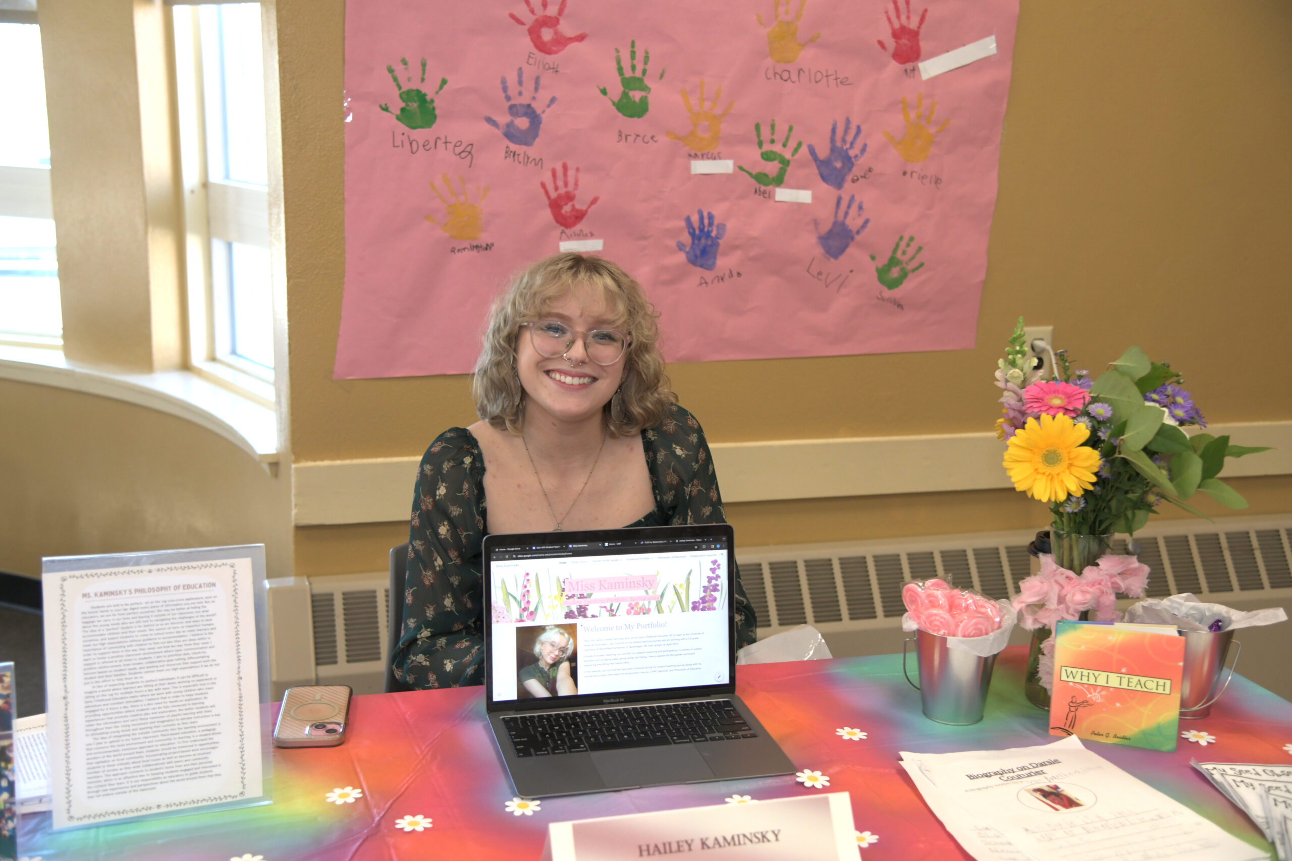A female student working within the Student Center at a table