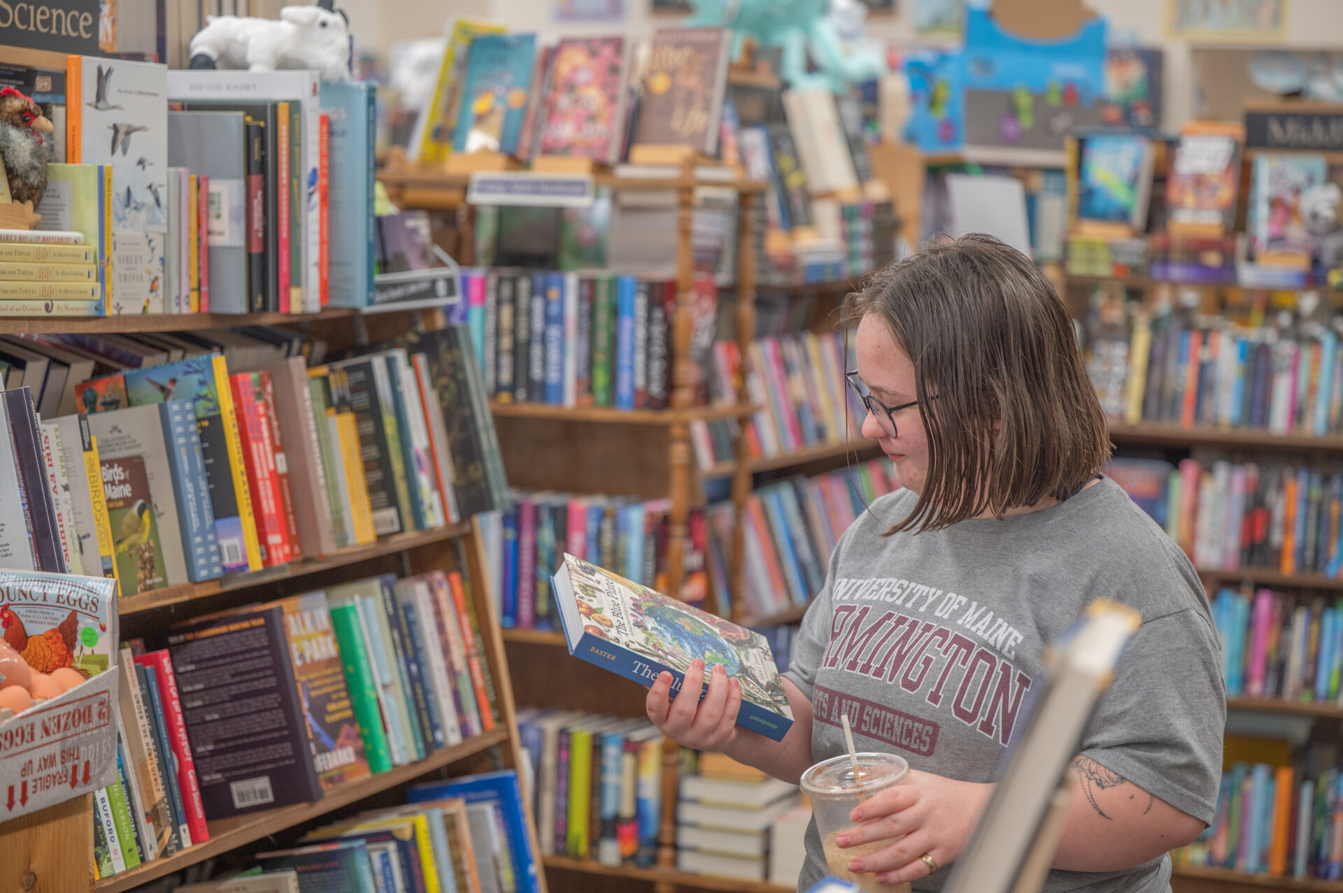 Student browsing books in a bookstore