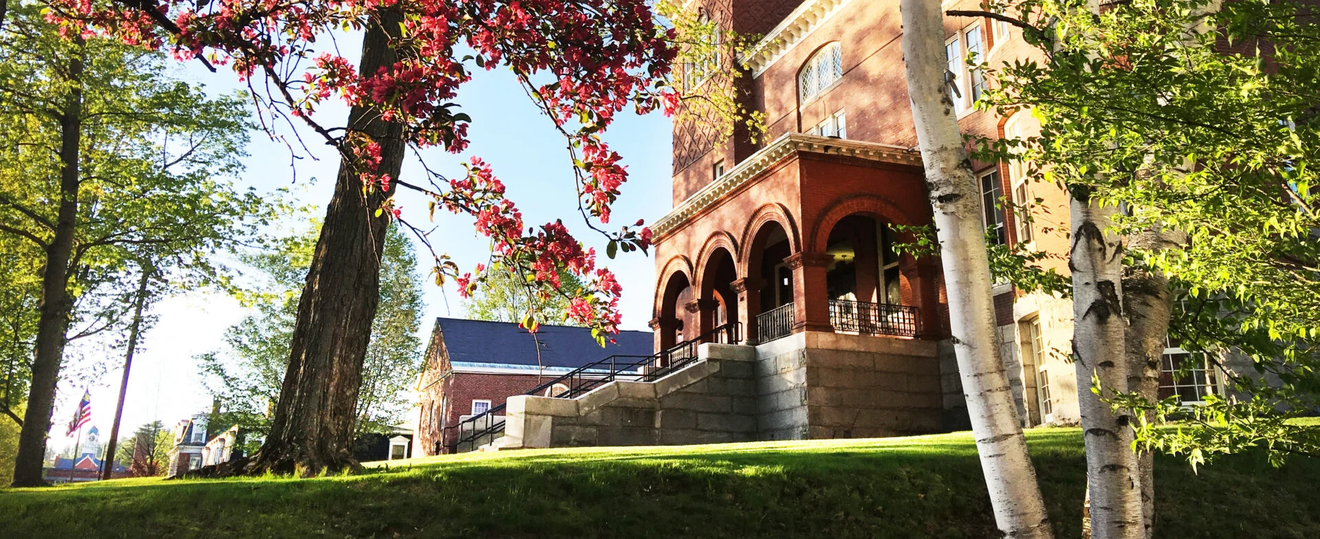 Spring outdoor photo of the exterior of UMF building Merrill Hall