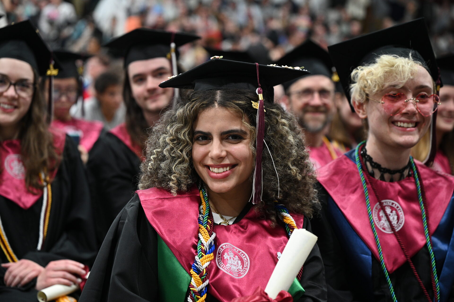 A group of smiling students at commencement