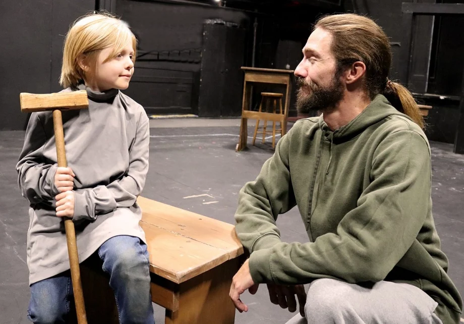(Left to right) In an early rehearsal, Tiny Tim (Charlie Potts) and Bob Crachit (Tim Berry) share a moment as they work on a scene.