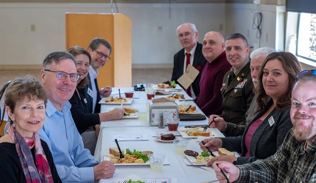 UMF President Joseph McDonnell, his wife Carla, Maine Rep. Stephan Bunker and honored guests celebrate Veteran's Day with annual lunch.