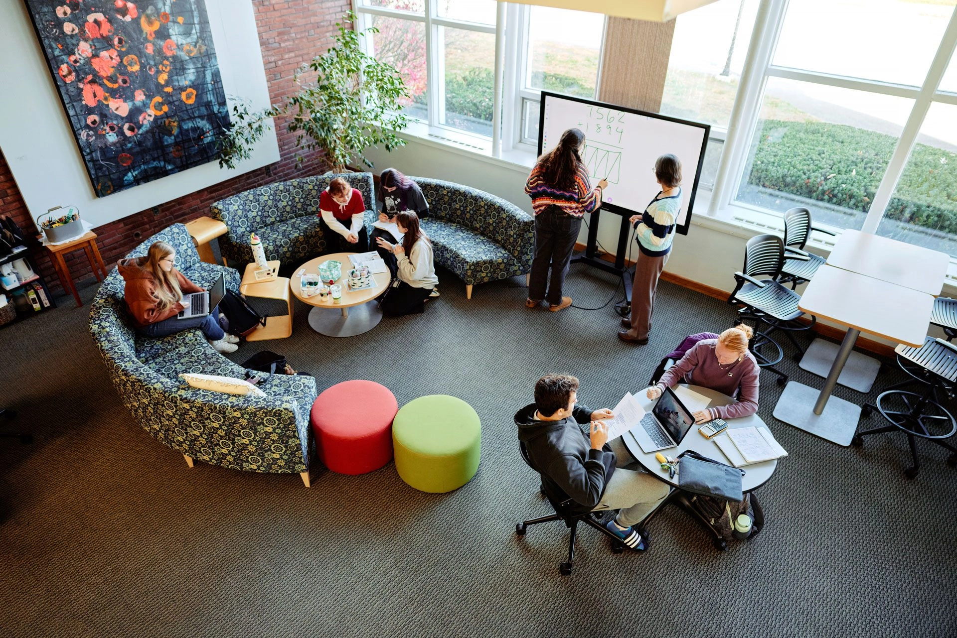 aerial image of students working in the library