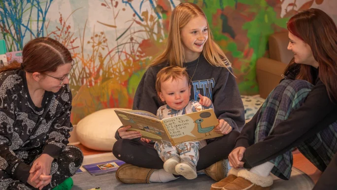 Children at UMF Sweatt-Winter Center and Mt. Blue Middle School 8th graders share the joy of reading with Reading Buddy program