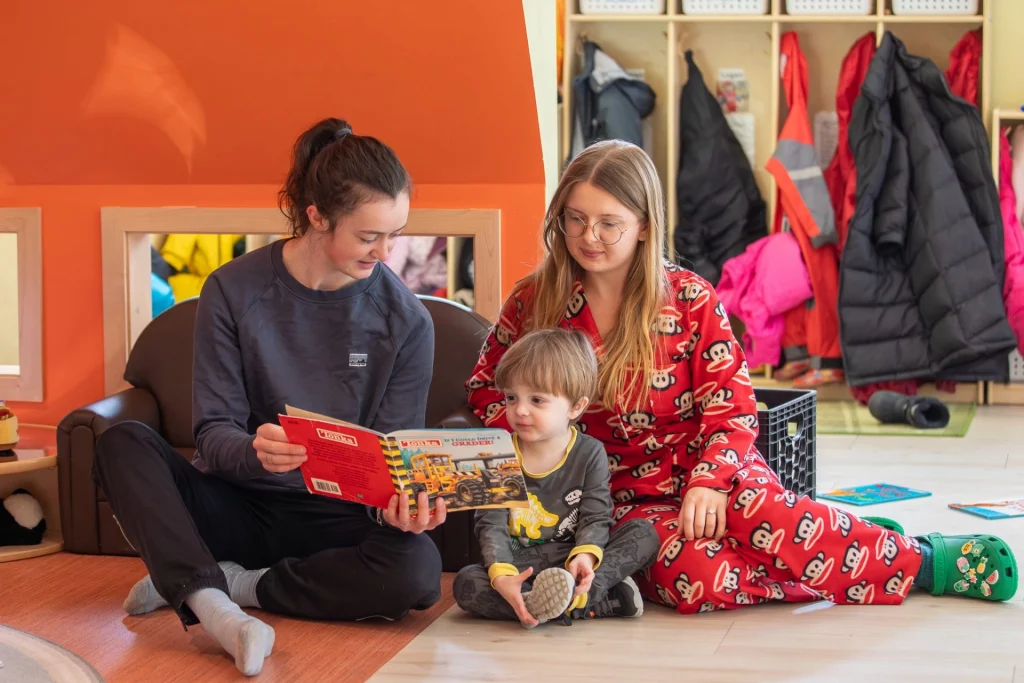 Sweatt-Winter teacher and UMF work-study student reading with their buddy.
