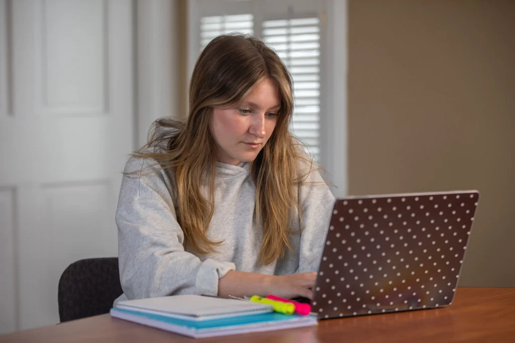 Person using laptop to study remotely