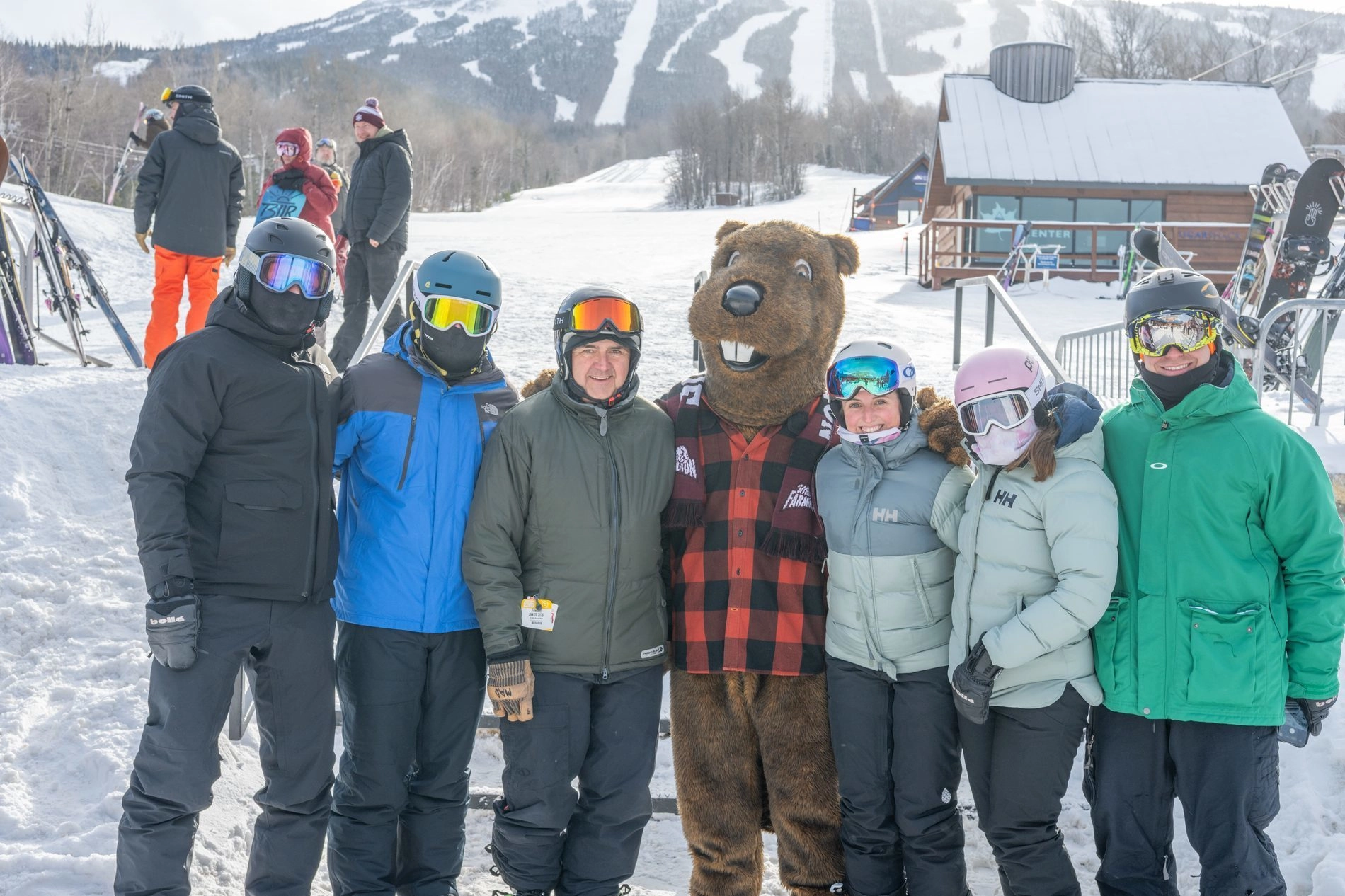 Alumni posing with Beaver mascot at Sugarloaf ski area