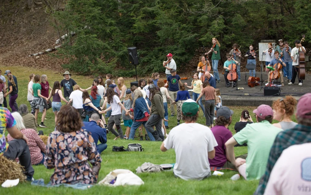 People dancing and enjoying music at the Fiddlehead Festival