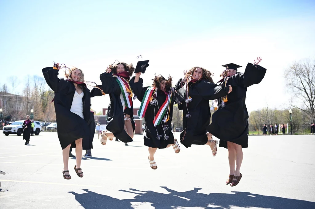 Group of UMF graduates jumping for joy