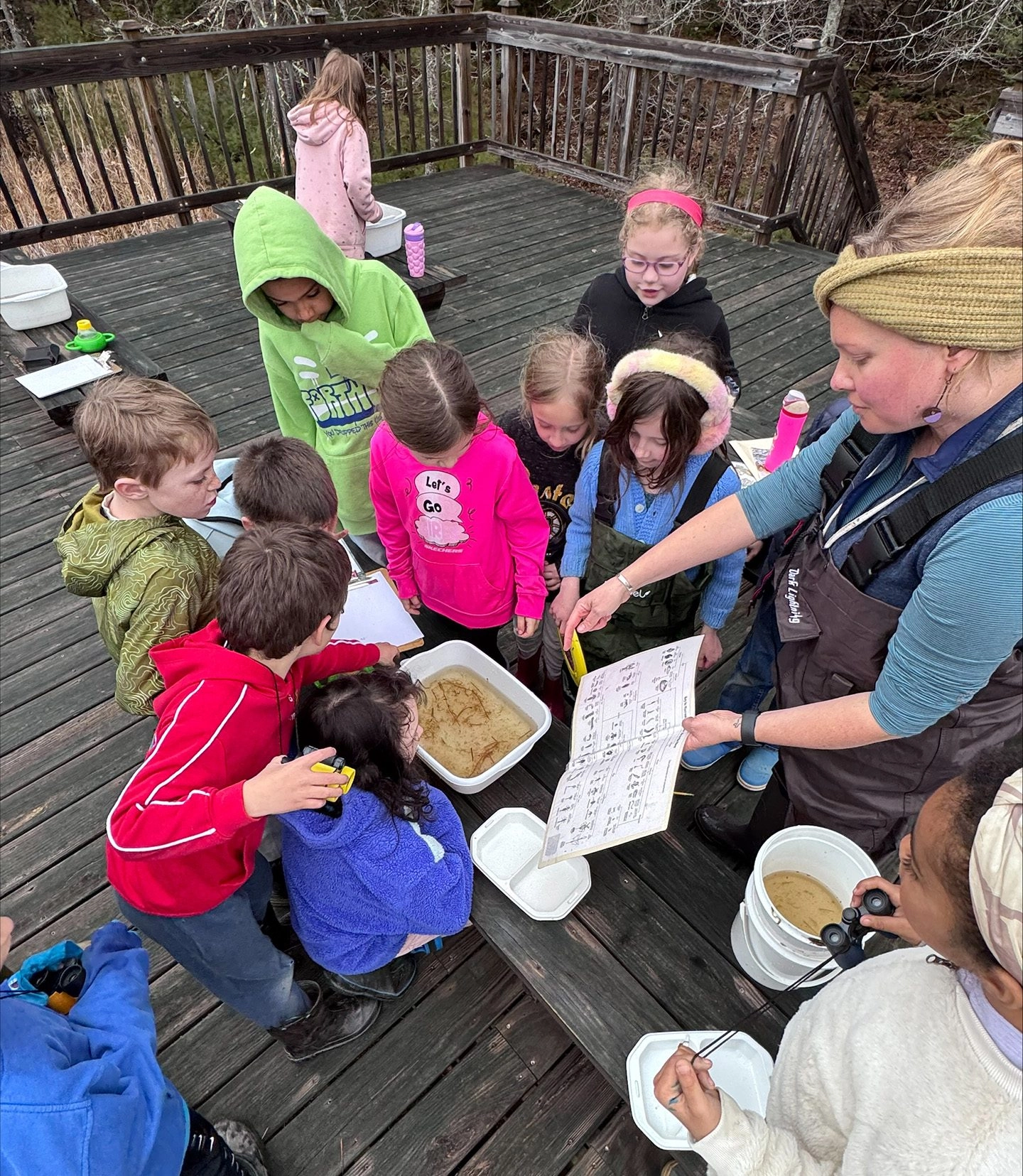 Rachel Norgang implements a place-based education approach as she shows students how to use a macroinvertebrate identification key during a ponding unit earlier this spring.