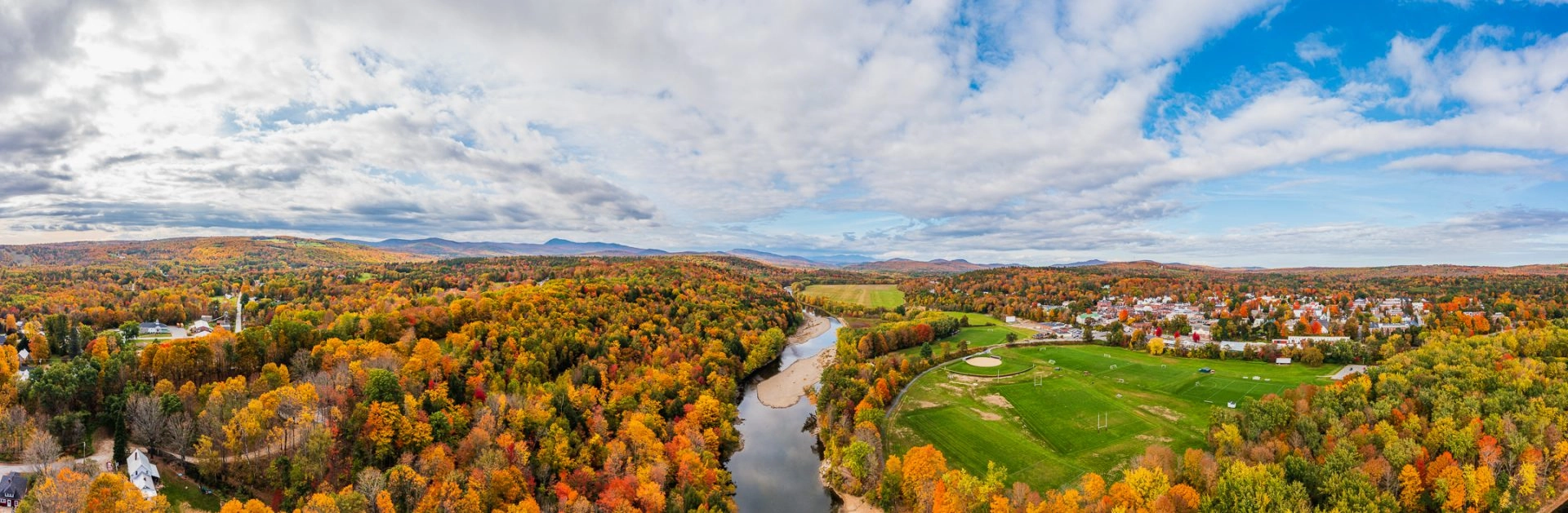 Panaroam view of the sandy river and surrounding Farmington area during peak fall foliage