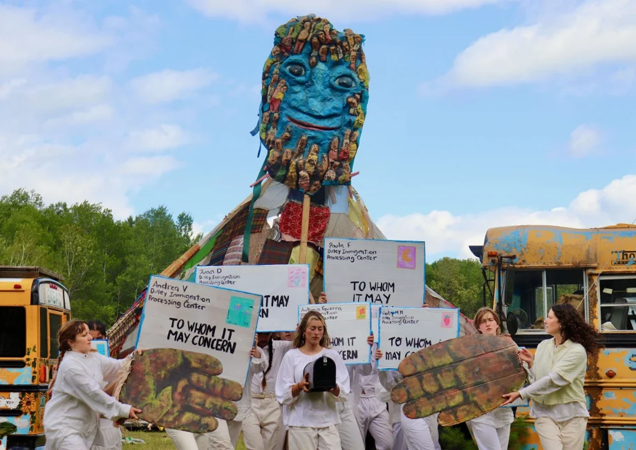 Tall puppet with performers